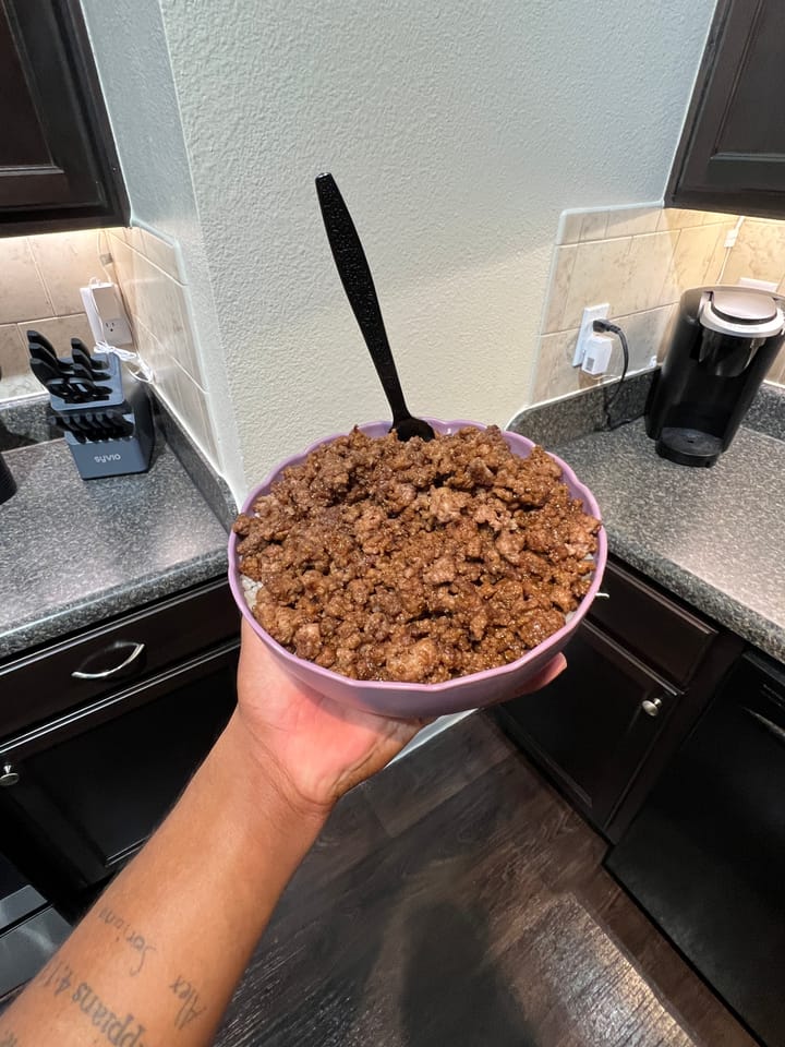 A photo of a bowl of teriyaki flavored ground beef and rice.